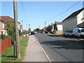 Looking towards the post office on the B2177 in Waltham Chase village centre