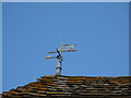 Weather vane used as target practice