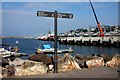 Signpost on the seafront at Brixham