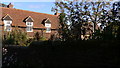 The farmhouse at Hall Place Farm seen from bridleway