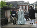 Strollers in costume crossing the Magazine Gate