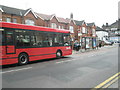 Bus approaching a stop opposite the Methodist Centre