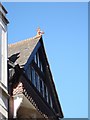 A dragon on a shop roof in Exeter