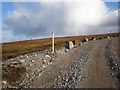 NH2809 : Windfarm road crossing moorland by Sarah McGuire