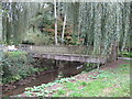 Footbridge over brook leading to Woking Park