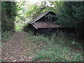 Derelict timber building off Crimbourne Lane