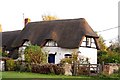 Thatched cottage on the village green in Marsh Baldon