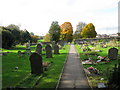 Looking W along church path through graveyard