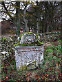 A gravestone at an old burial ground near Cranshaws Farm