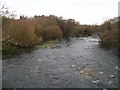 The swollen Seiont below Pont Rhythallt bridge