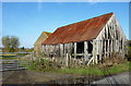 TQ8466 : Derelict farm building at Holywell Farm by pam fray