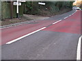 Signpost at the junction of the B2028 with Vowels Lane