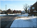 Approaching the junction of  Dorlcote Way and Roke Lane