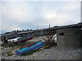 Pillbox and sheds beside the shore at Peveril Point