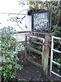 Metal gate and graffiti footpath sign, Kempson Avenue