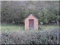 Small shed in a field