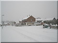 Approaching the junction of  a snowy Hooks Lane and Talbot Road