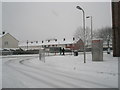 Approaching the junction of  a snowy Hazleholt Drive and Barncroft Way