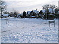 Junction of Oakwood Avenue and a snowy Littlepark  Avenue