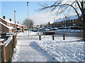 Approaching the junction of  a snowy Purbrook Way and Park House Farm Way