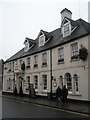 Pedestrians passing The Swan Hotel