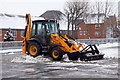 JCB clearing snow from the car park