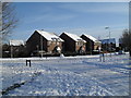 Looking along a snowy River Way towards Old Copse Road