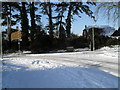 Junction of a snowy Lavant Drive and Leigh Road