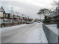 Approaching the junction of a snowy Court Lane and Hilary Avenue