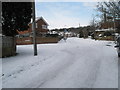 Approaching the junction of a snowy East Cosham Road and Courtmount Grove