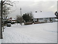 Junction of a snowy Courtmount Grove  and East Cosham Road