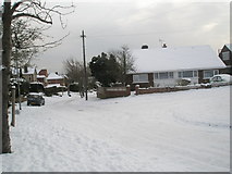SU6605 : Junction of a snowy Courtmount Grove  and East Cosham Road by Basher Eyre