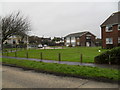 Looking across from Cove Road over a small green  towards Harsfold Road