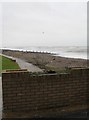 Looking over a wall in Sea Road towards Rustington Beach