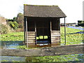 Partially submerged bus shelter at Abingworth