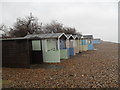 Pastel coloured beach huts on Broadmark Beach