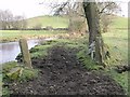 Old field gate by a river