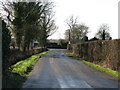 View along road towards junction at Chequertree