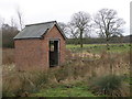 SP9593 : Brick shed by the footpath by Michael Trolove