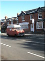 Splendid old camper van outside G.M. Luff & Partners in Lion Lane