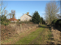 TL8884 : Former farm cottages in Green Lane by Evelyn Simak