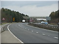 The A40 narrows under the bridge to Whitehouse Farm