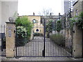 Gated entrance to 47-53 Warriner Gardens London SW11