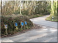 Water main signs by the junction at Cost-is-Lost