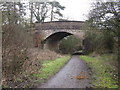 The A264 , Five Oaks Road, bridging the Downs Link path