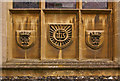 Carvings below west window of St Nicholas