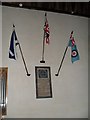 Flags on the north wall at  St Andrew, Tangmere