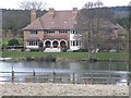 Large house and lake near Fineshades Wood