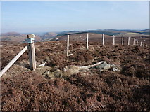 SH9926 : Fence in high moorland. by Peter Aikman