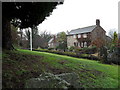 Houses seen from the churchyard of St John the Baptist, Sutton